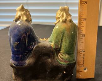 M114 - $25. Mudmen playing a game. Measures 4" wide x 4.5" tall. 