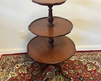 M5 - $65. 3 Tier Pie Crust Table. Measures 24" wide x 41.5" tall. Wood between tables 2 & 3 has a significant crack and needs repair. 