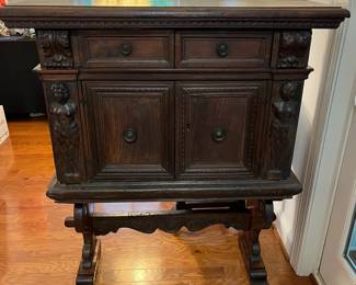 M105 - $650. Antique Renaissance Style Carved Walnut (?) 2 piece cabinet. Top & Base Move separately. Measures 38.5" x 15" deep x 46" tall. Hardware is all handmade - primitive. 