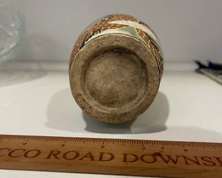 K17 - $15. Glazed Chinese Vase with Dragon Motif. Measures 8" tall. 