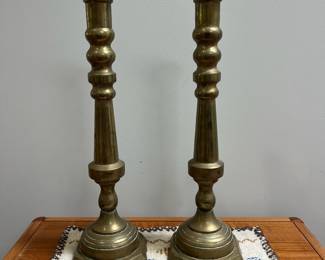 K53 - $95. Large Brass Candlesticks. Measures 5.75" wide x 19.5" tall. 