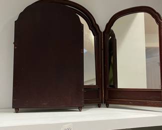 M110 - $125. Hand Painted Antique Tri-Fold Mirror. Center Mirror moves. Measures 54" x 28.5". Middle is 22.5" Each End is 16". 