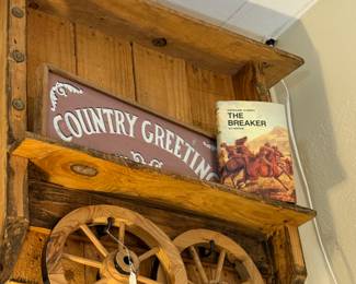 old signage, wagon wheels, books