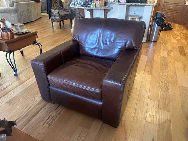 Moroni Brown Leather chair 39"W x 43"D x 33"H. Really comfortable, good condition