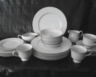 Dinnerware China set-floral rim design. 6 plates; 4 desert plates; 2 saucers, 5 coffee plates, 5 coffee cups, 1 creamer bowl, 1 large oval serving platter.