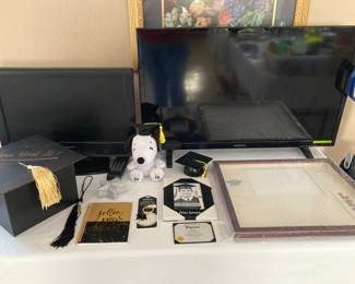 two TVs, graduation items