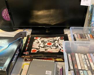 Insignia TV, VideoNow player and games, guitar music books