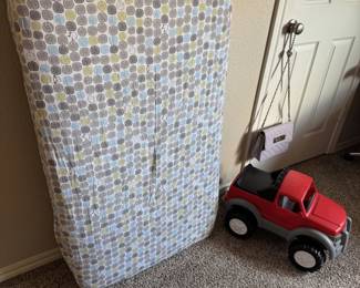 Baby Crib Mattress and plastic truck