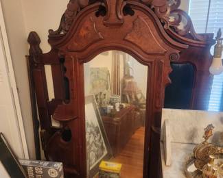 This mirror goes on top of marble topped dresser