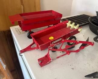 TWO TOY FARM WAGONS AND BOTTOM PLOW