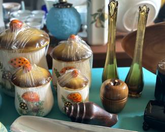 2 Amber 12 inch swung vases. Carved wooden apple trinket box. Solid walnut wood carve shell. Sears and Roebuck Merry Mushroom set of 4 canisters.