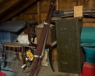 Footlocker. WWI trench spade. Fishing poles. 