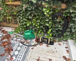 Garden hoses, boot scraper, watering can