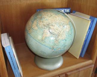 Globe - where do you want to travel next? lots of travel books and maps