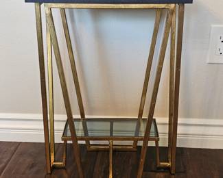 Uttermost gold tone metal black granite top side table. (2 available)