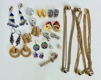 Four (4) pairs of stud earrings with rhinestones, (7) pairs of rhinestone clip on earrings, (1) gold and silver tone candy cane brooch and (1) 50" length gold tone necklace. See photos for details. Shipping-YES