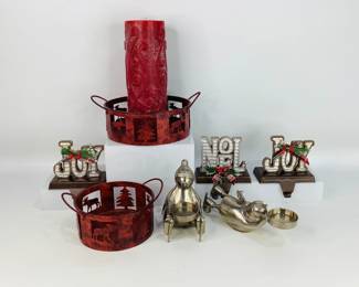 Candle & Stocking Holders. Includes (2) whimsical pewter Penguin votive tea light candle holders, (2) metal baskets with a moose and pine tree motif, and (3) stocking holders that read "Joy" and "Noel".