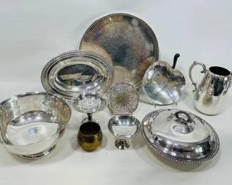 Lot includes an elegant collection of silver-plated holloware featuring a serving tray with ornate engraving, various serving bowls (one is personalized), candy/ nut/ fruit dishes, a water pitcher, and additional classic tableware pieces. Shipping-YES