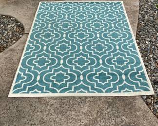 Claremont area rug in turquoise with white geometric pattern. Some light staining in one area. 60" x 91". See photos for details. Shipping-NO