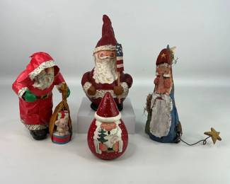 Santa! Features four uniquely handcrafted Santa figurines: papier-mache figure holding a flag, H 10", (1) papier-mache figure carrying a bag of gifts, H 9", (1) hand carved wooden figure wrangling a star, H 9 1/2", and (1) Folk Art-style gourd-shaped figure, H 5 3/4". Shipping-YES