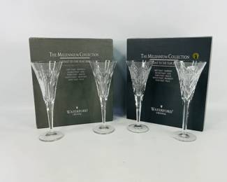 This lot includes two pairs of Waterford Crystal Millennium Collection toast flutes— 'Love' and 'Happiness'—each elegantly etched to celebrate sentiments from the 'A Toast to the Year 2000' series.