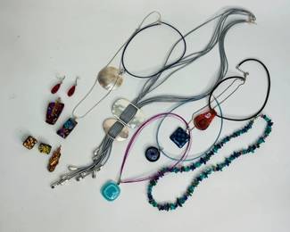 One (1) Native American style beaded necklace, possibly turquoise, malachite and lapis lazuli, 26" length. (6) mixed media pendants of various designs made from glass, epoxy resins, metals and more. Some have wire wrapping and matching earrings. See photos for details. Shipping-YES