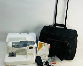 Baby Lock Decorator's Choice Sewing Machine model BLDC. Includes power cord, pedal, manual, and rolling sewing machine tote. Powers on. Shipping-NO
