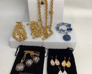 Boxed jewelry believed to be from the Joan Rivers Classic collection. Includes chunky 3 strand gold tone choker necklace, 18" length, and (2) matching bracelets, 8" length, all with gold heart charms. 3 piece box set with silver crest on black backing including pair of clip on earrings and pendant on 28" chain. Lot also includes 3 pairs of hammered metallic earrings and a pendant and bracelet set with no markings. See photos for more details. Shipping-YES