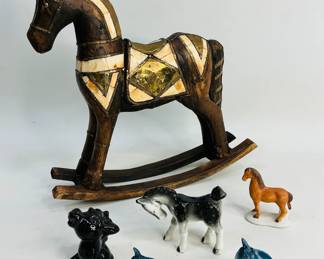 A unique mix of equine elegance figurines is highlighted by a stunning Mid-Century Marwari-style wooden rocking horse adorned with intricate bone and hammered brass inlay, a pair of stately horse head salt and pepper shakers, a playful ceramic donkey full of personality, and two graceful horse figurines Shipping-YES