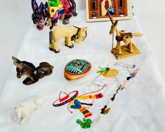 Mexican Heritage Collection, (1)Embroidered Tablecloth 60" X 40", (1) Earthtones Bienvenidos Trivet, (1) Pottery whistle, (5) Burro figurines. Shipping-YES
