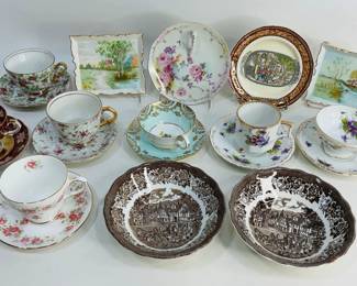 Assortment of fine china teacup and saucer sets from makers like EW Princess, Victoria, and Duchess—each showcasing delicate florals, gilded accents, and classic craftsmanship—paired with a small selection of collector plates and bowls. Shipping-NO