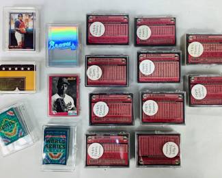 Assorted MLB Trading Cards. Includes a 1989 Topps trading card set (appears to be complete but cannot verify), a 1991 Donruss Willie Stargell Puzzle, 1991 Upper Deck Hologram Team Stickers, and a 1991 Score Trivia card game. Shipping-YES