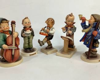 Five music themed Hummel figurines to include: "Hear Ye, Here Ye" #15/0, "Sweet Music" #186, "Soloist" #135, "Little Drummer" #240, and "Band Leader" #129. Heights range from 4" to 5". Items have crazing and some wear to finish. Shipping-YES