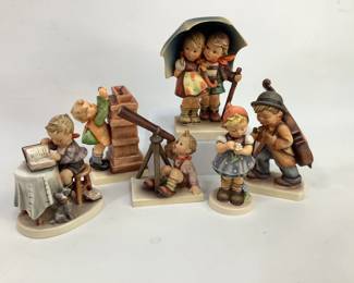 Six (6) assorted Hummel figurines including: "Stormy Weather" #71, "Little Cellist" #89/1, "Little Thrifty" coin bank #118, "Stargazer" #132, "Little Bookkeeper" #305, and "Daisies Don't Tell" #380. Heights range from 5" to 6". Figurines have crazing and some wear to the finish in areas. Shipping-YES