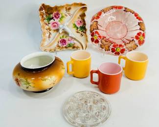 Vintage Housewares. This lot features an antique Warwick IOGA vase adorned with a delicate poppy design, three colorful Hazel Atlas fired-glass mugs, a unique Lipper & Mann square divided dish with scalloped edges and floral motif, plus more. Shipping-NO