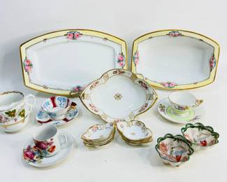 This lot offers a blend of antique and vintage porcelain, featuring a hand-painted Nippon rice bowl and matching sauce bowl set by Morimura with delicate floral detailing, a graceful Rosenthal serving dish paired with a matching bowl, several small fine china teacup and saucer sets in various patterns, and additional accent pieces Shipping-NO