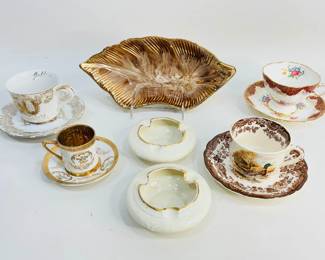 This lot features a vintage California Pottery dish #2915 in its iconic mid-century flair, a pair of Rosenthal vintage ashtrays, and a selection of fine china teacup and saucer sets. Shipping-NO