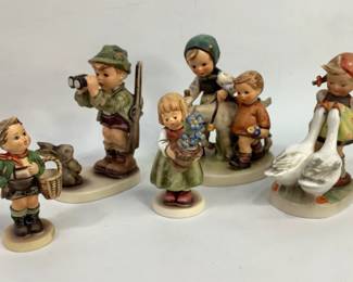 Assortment of (5) Hummel figurines including: "Homeward Bound" #334, "Good Hunting" #307, "Birthday Present" #341 3/0, "Village Boy" #51 3/0, and "Goose Girl" #47/0 with damaged hair. Heights range from 4" to 5". All items have some crazing. Shipping-YES
