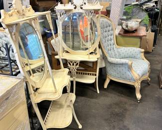 Mirrored shelving.  Upholstered chairs.