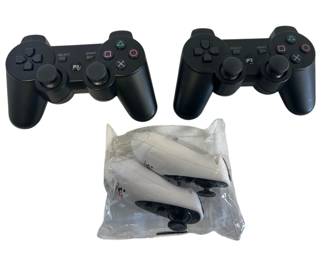 Two PS3 Wireless Controllers and Racing Controllers 