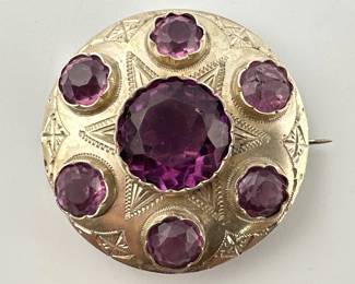 Sterling brooch with purple glass