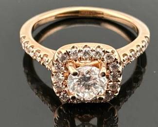 Size 5 ring has center diamond with diamond halo, diamonds along band and two diamonds in gallery, all set in 14kt rose gold; 2.80g. (Center stone is .40ct G Si clarity) .75ctw.