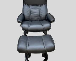 Black leather Ekornes Stressless “Senator” recliner with ottoman