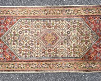 Hand knotted Tabriz area rug in brick tones with blue and green accents; 28"W x 52"L