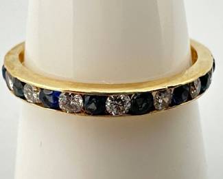 Size 8 14kt channel set natural sapphire and diamond (VS clarity) band; 2.66g.