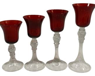 830 - 4 Red & Clear Glass Candleholders 7, 7.5, 8.5, 9

