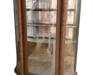 2485 - Original Tiger Oak Curved Glass Cabinet Carved columns, paw feet, mirrored back 65 x 47 x 17
