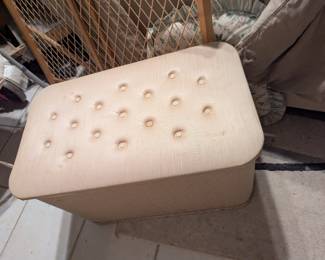 Ottoman with storage space inside. Older and has some awesome advertisement for itself on the lid, very cool.