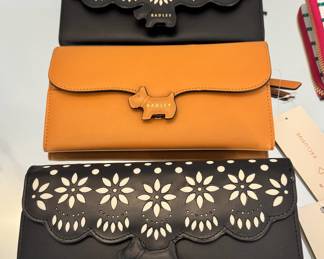 Four New With Tags and one New Without Tags Radley London wallets.