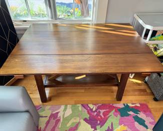 Space saving console that can fold open to a small dining table 